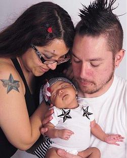 Denise, her husband, and baby Nikte.