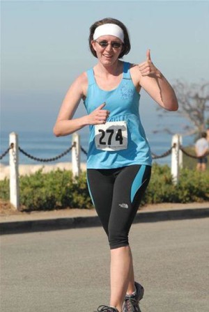 Proud but exhausted approaching the finish line of my second half marathon.