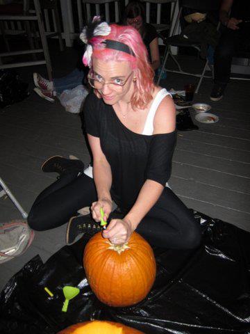 This is me carving a circular opening in the top of my pumpkin.