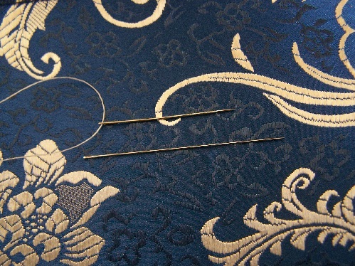 Top: Regular sewing needle. Bottom: Beading needle.