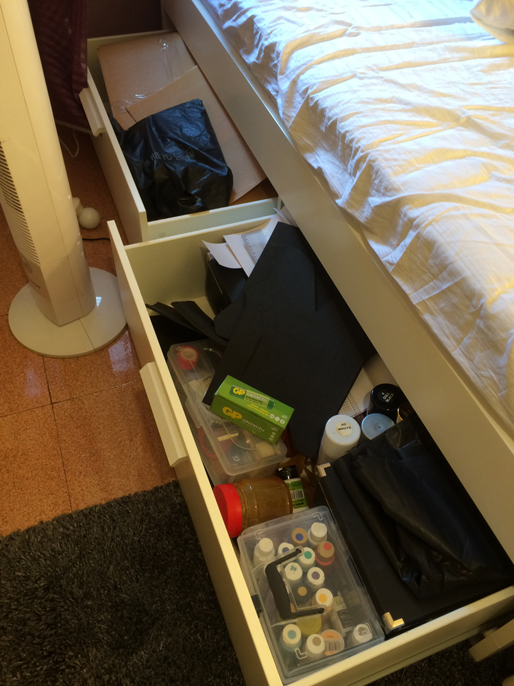 These cupboards located under the bed are where I store all my raw materials for my prop-making. In Asia, it is common for us to use polyurethane foam. In the cupboard behind, you can find Worbla that I got from Europe. I am still experimenting with it as I am using only starting to use them.