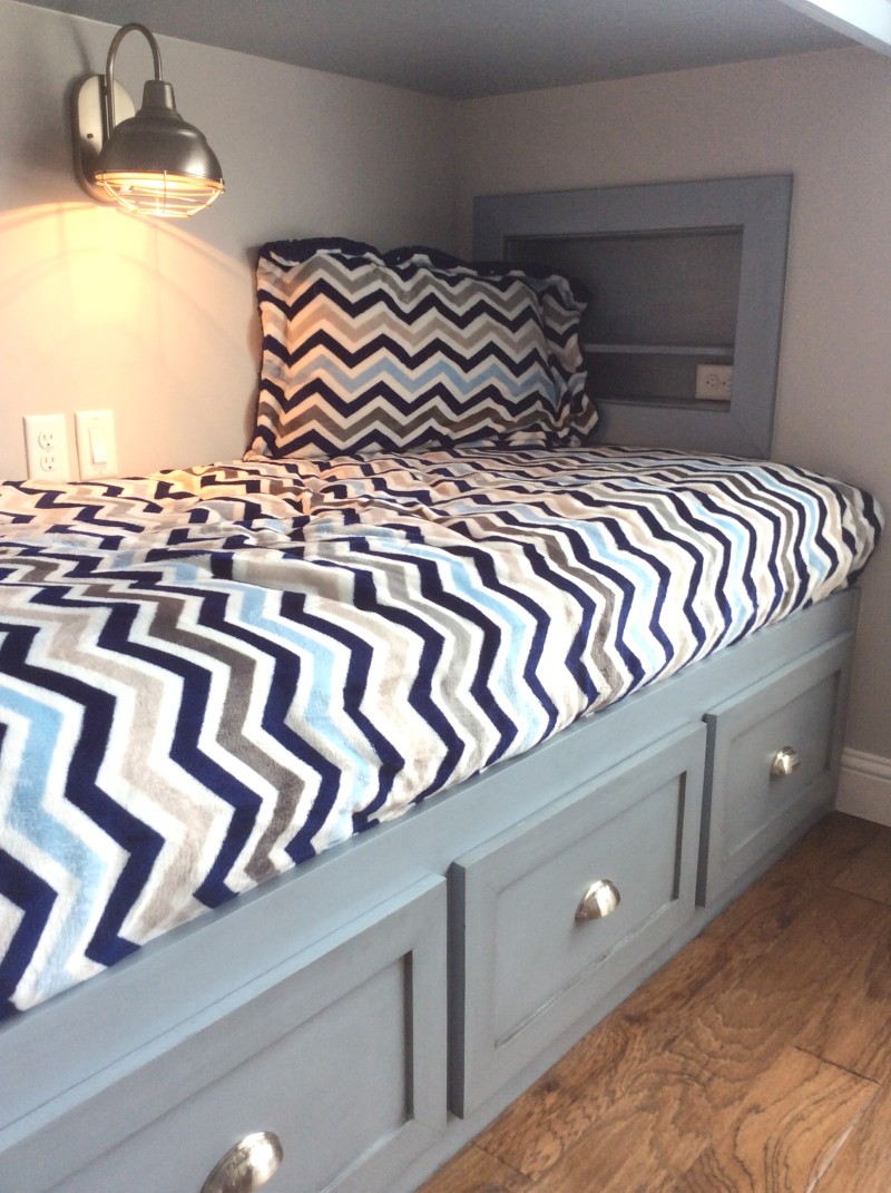 bunk bed with storage and cubby
