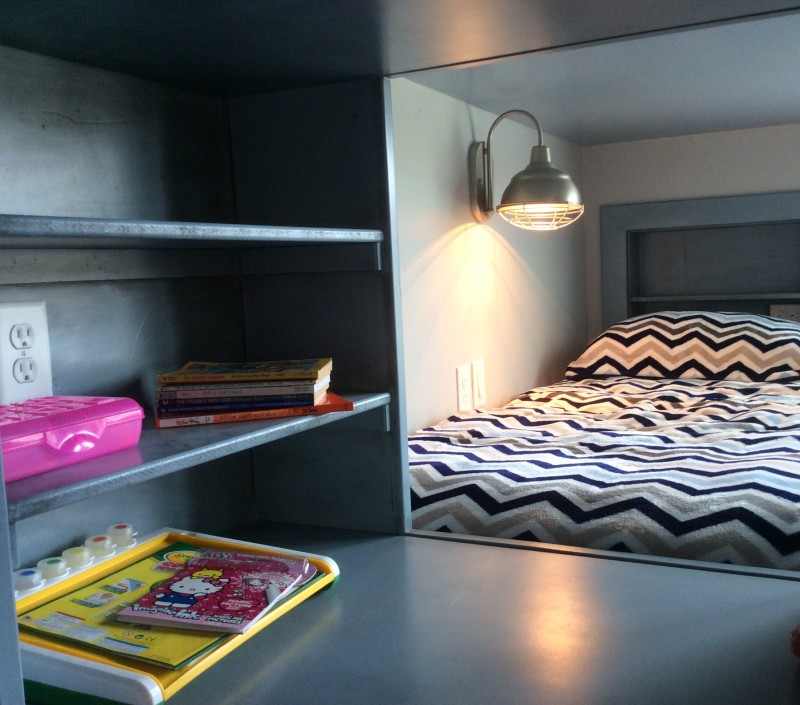 shelf and crawlspace between the beds