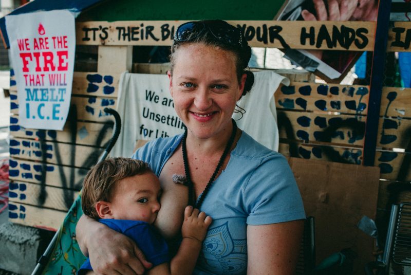 These photos of moms & babes nursing in protest of family separation will hit you right in the FEELS