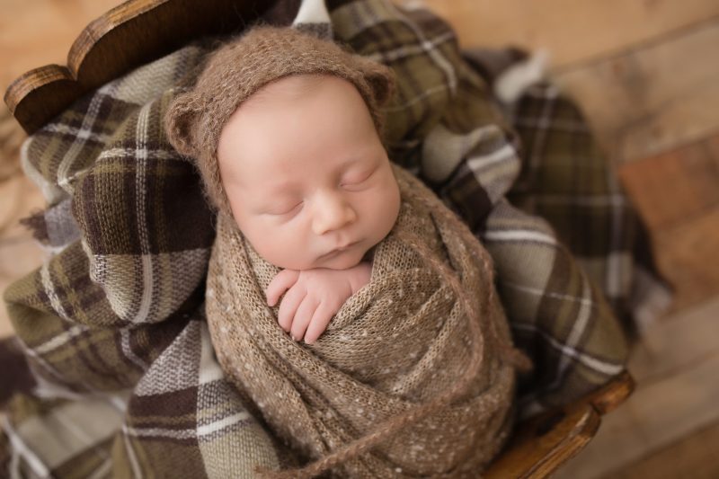 Try not to squee too loudly when you see this newborn dressed up as a baby bear